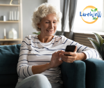 The pensions scandal has mainly affected pension age women. Mature woman sit on sofa while she checks her finances.